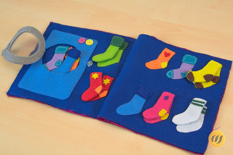 Die Quietbookseite mit der Waschmaschine und Socken